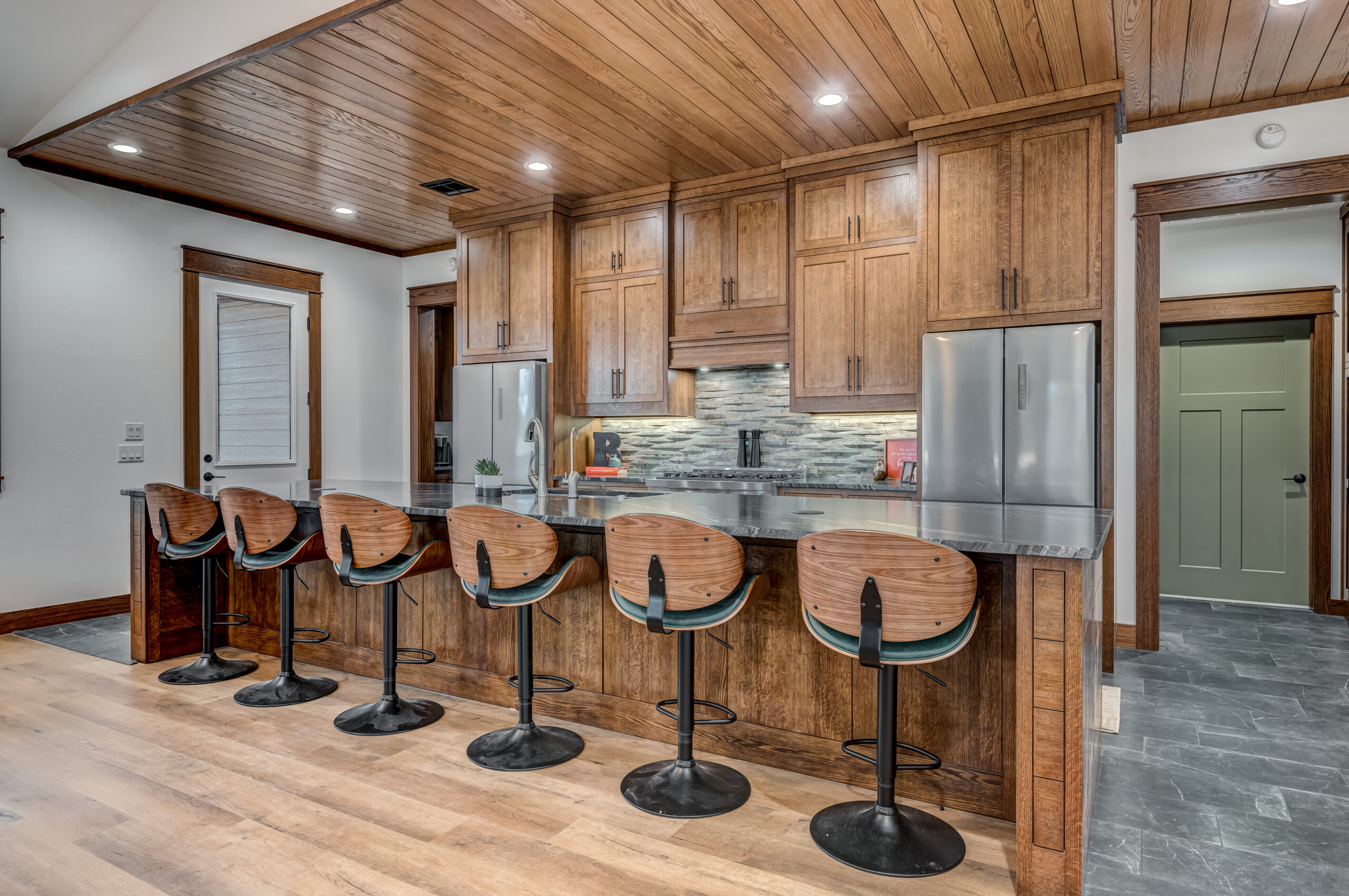 Timeless Classic Gorgeous cabinets over bar area.